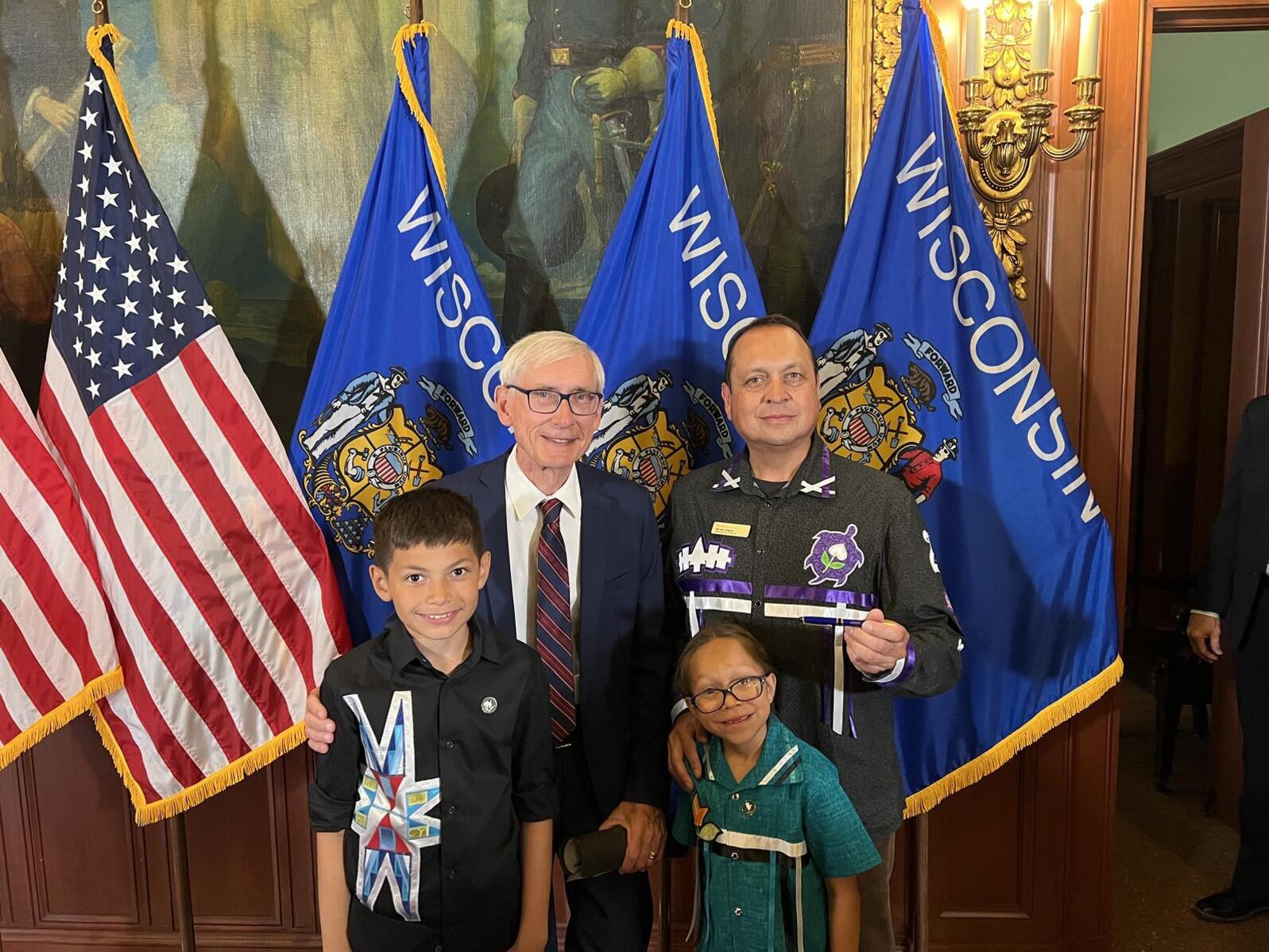 Wisconsin Governor Evers signed the state budget at the State Capitol in Madison, WI. Audubon Great Lakes Freshwater Policy Director, Brian Vigue, and his children were among the the group that joined the press conference. L to R: Otto Vigue, Wisconsin Go